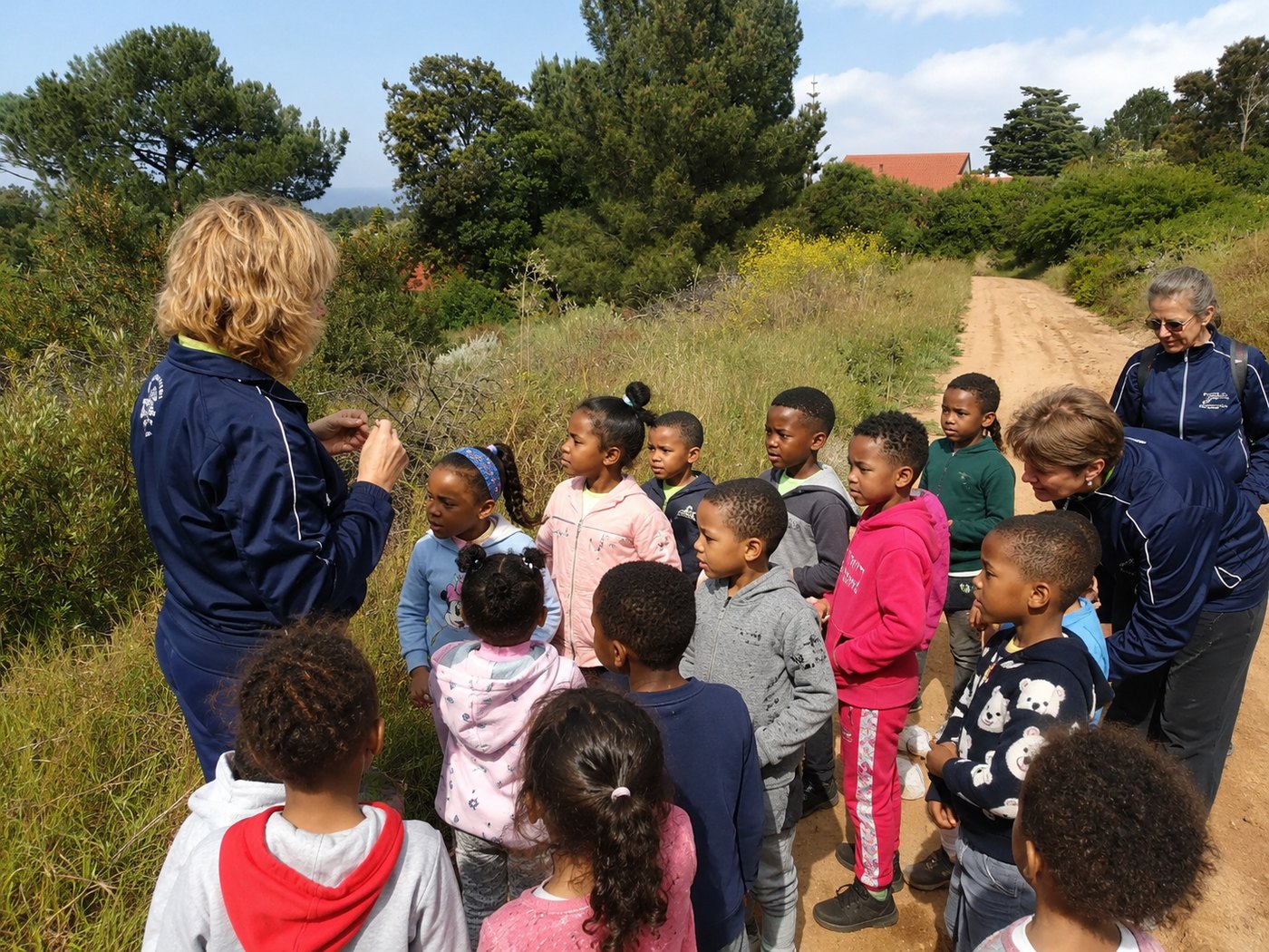 Stopping on a nature walk to take a closer look at what teacher has found