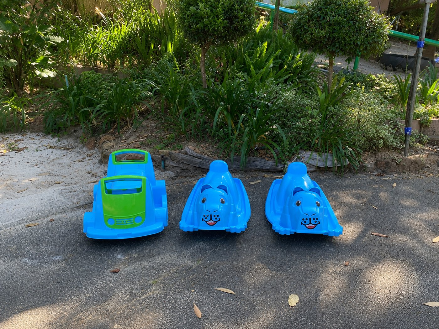 Ride-on toys parked and waiting for the next little driver