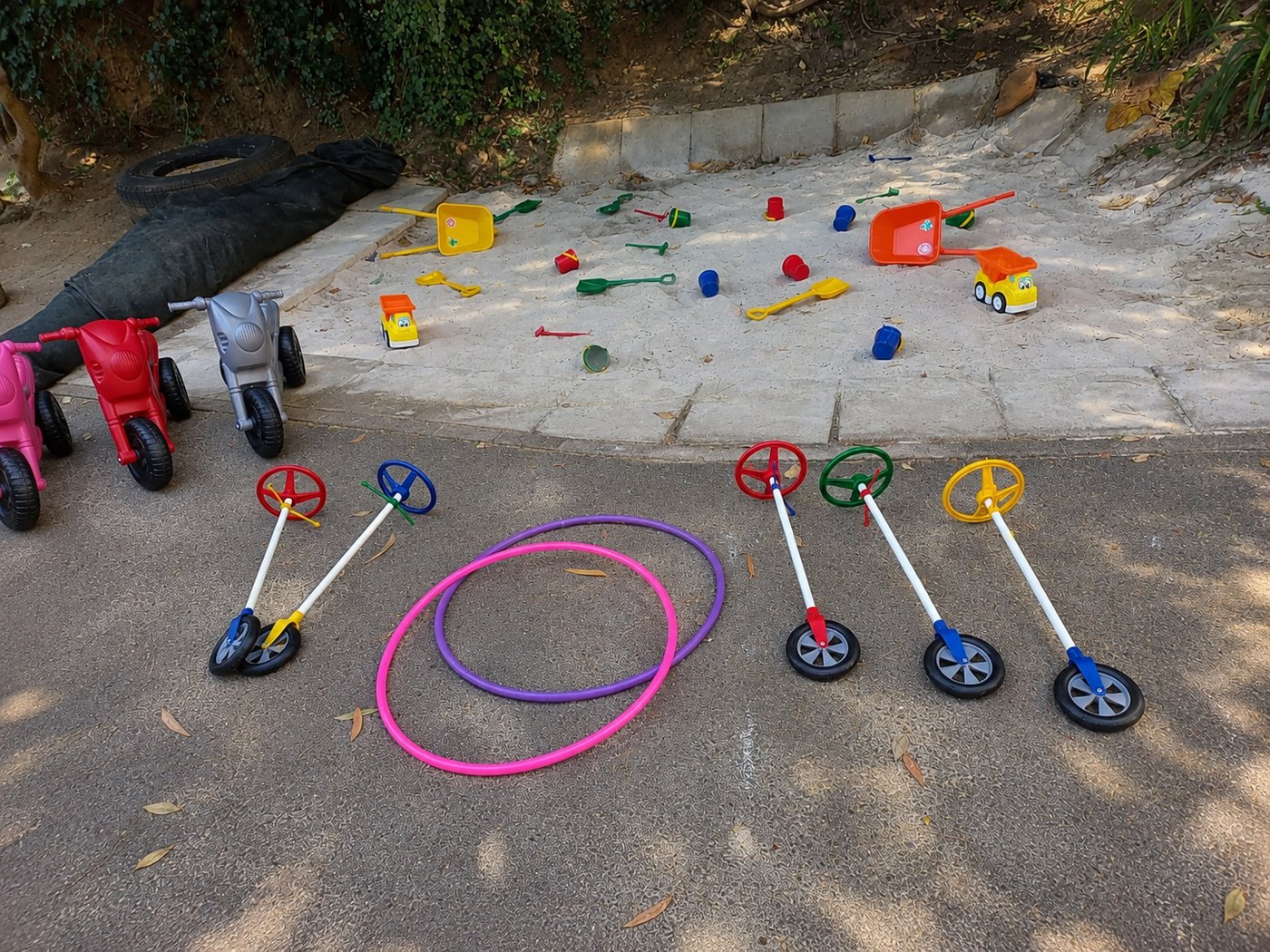 Hoops, scooters, spades and buckets set out before the children come outside