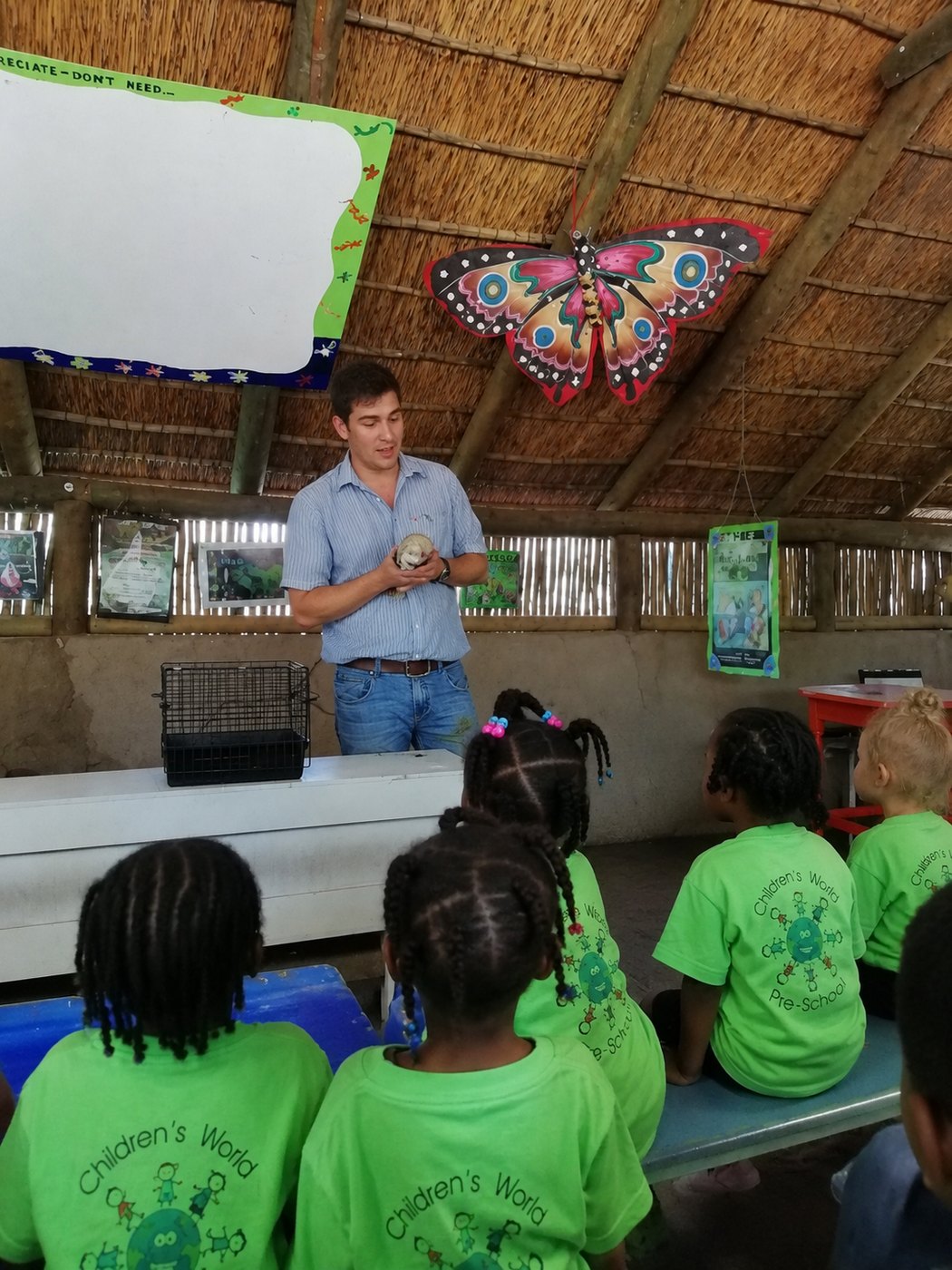 The keeper introduces the first of the day's animals