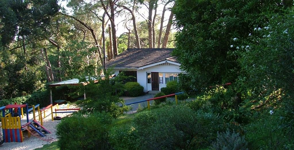The Children's World building, tucked in among the trees